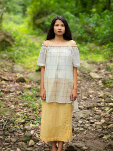 Model wearing Handwoven Off-shoulder tunic with high-low hem, designed by Khumanthem Atelier, front view.