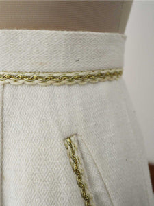 close up view of the lace details on the pockets of the pencil skirt, designed by Khumanthem Atelier