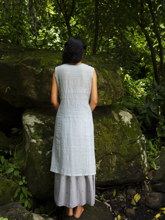 Model wearing Handwoven Sleeveless Cotton Tunic with gathered front Dress, designed by Khumanthem Atelier, back view