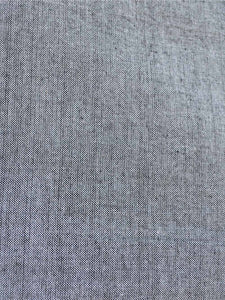 Close up view of the material of Handwoven cotton High low hem straight top, full sleeves designed by Khumanthem Atelier