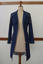 Load image into Gallery viewer, close up front view of Handwoven Trench coat with golden trims, designed by Khumanthem Atelier 
