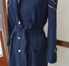 Load image into Gallery viewer, close up view of the belted details on the trench coat designed by Khumanthem Atelier