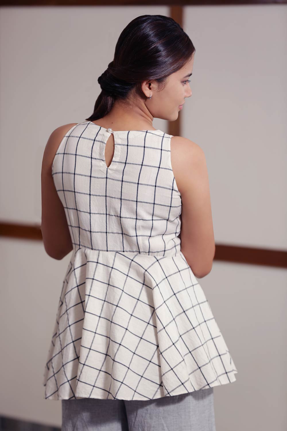 Handwoven cotton Checked Top With Flared Waist, designed by Khumanthem Atelier