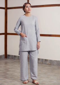 Full view of model posing with Handwoven cotton High low hem straight top, full sleeves designed by Khumanthem Atelier