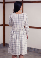 Load image into Gallery viewer, Back view of Checked peasant dress with running stitch design, designed by Khumanthem Atelier