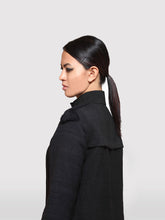 Load image into Gallery viewer, Side view of model wearing the Braided Shoulder Overcoat made from handwoven mulberry and Eri silk designed by Khumanthem Atelier