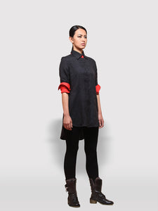 View of model wearing Reversible Black and Red Shirt Dress made from handwoven mulberry silk designed by Khumanthem Atelier