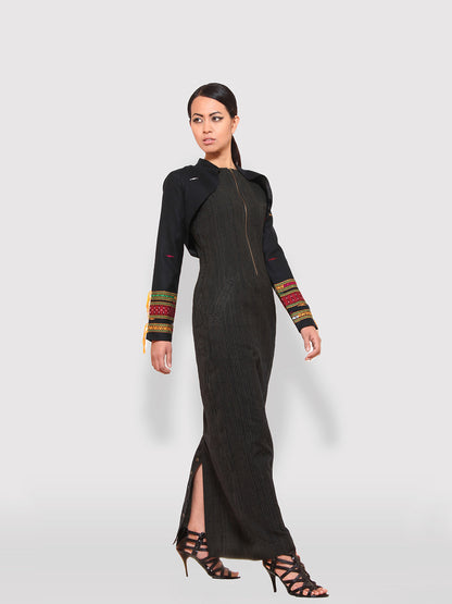 Model posing wearing Handwoven traditional motif Long sleeves shrugs with Extra Weft designed by Khumanthem Atelier