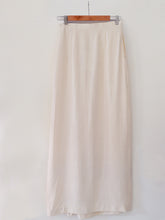 Load image into Gallery viewer, Back view of Diamond patterned pleated Maxi Skirt with slit made from 100% pure cotton, designed Khumanthem Atelier