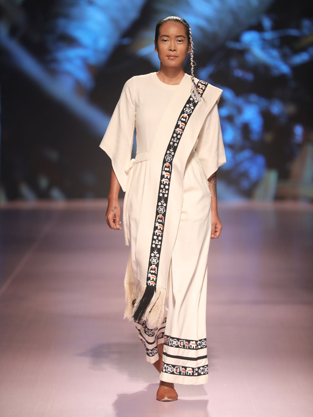Front view of model ramp walking wearing Jumpsuits for women (Sha-Nga Motiff), designed by Khumanthem Atelier during the Lakme Fashion Week 2018
