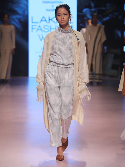 Ramp walk front view of model wearing the off white handwoven silk coat, designed by Khumanthem Atelier, during Lakme Fashion Week, 2018