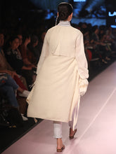 Load image into Gallery viewer, Ramp walk Back view of model wearing the off white handwoven silk coat, designed by Khumanthem Atelier, during Lakme Fashion Week, 2018