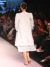 Load image into Gallery viewer, Ramp walk Back view of model wearing White petal sleeves coat for women handwoven from cotton designed by Khumanthem Atelier, during Lakme Fashion week, 2018
