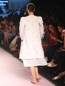 Ramp walk Back view of model wearing White petal sleeves coat for women handwoven from cotton designed by Khumanthem Atelier, during Lakme Fashion week, 2018
