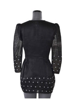 Load image into Gallery viewer, Back view of hanger shoot of Hand embroidered Sheer Black Coat with sprinkle of creme flower with puffed shoulder handmade from mulberry silk designed by Khumanthem Atelier