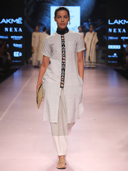 Ramp walk view of model wearing Handwoven Straight Checkered Tunic Dress (Shamee-Lanmee Motif), designed Khumanthem Atelier, during Lakme Fashion week 2018