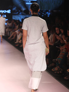 Ramp walk back view of model wearing Handwoven Straight Checkered Tunic Dress (Shamee-Lanmee Motif), designed Khumanthem Atelier, during Lakme Fashion week 2018